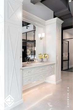 A classic grey vanity with X-mullion doors, crystal knobs, high glass framed mirror and linen towers. Dream Vanity, Grey Vanity, Linen Cabinets, Gray Vanity, Crystal Knobs