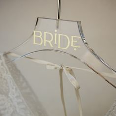 a bride hanger with the word bride on it