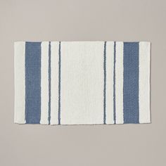 a blue and white striped rug on a gray background