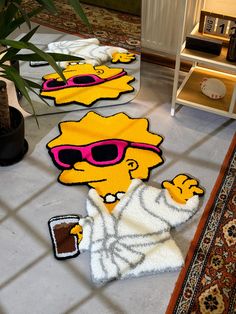 the rugs on the floor are made to look like cartoon characters wearing sunglasses and drinking coffee