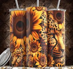 the sunflowers and leopard are painted on this tumbler