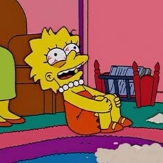 the simpsons character is sitting on the floor