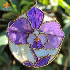 a stained glass flower hanging from a chain