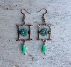 ✦Beautiful and original artisan designed turquoise green and copper bohemian earrings are a must have if you love handmade designer fashion. ✦Spiritual jewelry designed and carefully handcrafted by Rushweaver Jewellery in a ancient earthy tribal style. ✦These boho beauties dandle 75mm from top of solid brass copper plated, nickel free earring hooks. ✦For all free spirited women who want to enjoy there unique style! ✦100% artisan handmade... Handmade Rectangular Copper Earrings, Green Copper Earrings For Gift, Handmade Square Bohemian Earrings, Handmade Bohemian Square Earrings, Turquoise Artisan Electroformed Earrings, Green Bohemian Rectangular Earrings, Green Rectangular Bohemian Earrings, Handmade Green Copper Earrings, Handmade Copper Green Earrings