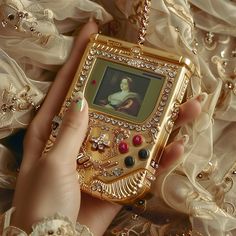 Step into a world of opulent nostalgia where vintage charm meets modern luxury. ✨📞🎮🦉 „When elegance calls, every moment becomes a jeweled masterpiece.“ Which piece of rococo-inspired luxury speaks to you? . . . #RococoElegance #VintageGlamour #LuxuriousLifestyle #ArtisticDesign #WhimsicalDécor #RetroLuxury #ClassicCharm #OpulentLiving #DecorativeArts #GamingArt #LuxuriousGadgets #WhimsicalDesign #OpulentTech #FantasyArt #EnchantedBeauty Vintage Modern Art, Dark Rococo Aesthetic, Rococo Modern, Random Things To Buy, Trinkets Aesthetic, Modern Rococo, Luxury Gift Ideas, Ring Unique Design, Pin Bag