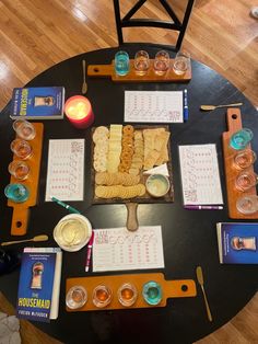 a table topped with lots of different types of food and drinks on top of it