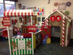 the children's playroom is decorated with gingerbread tents and candy canes