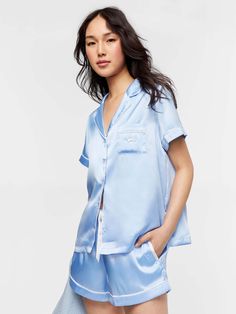 This ever popular women's satin pyjama set now comes in a luxurious cornflower blue with white satin trim. With this silky feel satin, it's so luxe you'll sleep like a queen. * Super soft satin * Lightweight and drapes beautifully * Collar & button down front * Top pocket with embroidered Penny logo * Short sleeves * Contrasting trim details * Matching PJ short * Elastic waistband * Satin drawstring * Side pockets * Comes in matching gift box Model is usually a size 8 and wears a small. Silk Pjs Peter Alexander, Peter Alexander Pajamas Silk Aqua, Shallow Hal, Silk Pijamas, Blue Satin Sleepwear Set