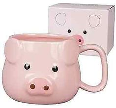 two pink pig mugs sitting next to each other