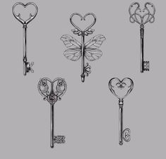 four different keys with hearts on them and two keyholes in the shape of heart