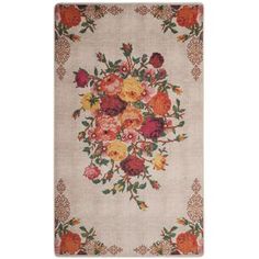 an area rug with flowers on it, in pink and orange colors is featured against a white background