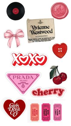 various stickers and decals are arranged on a white surface, including the words xoxo, prada, cherry