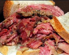 a corned beef sandwich on a white plate