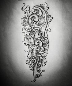 an intricate tattoo design on the back of a woman's arm, with swirls and