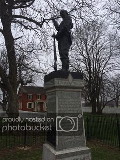 a statue in the middle of a park