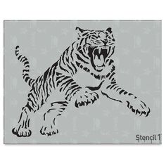 the stencil tiger is laying down and growling