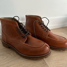 Never Worn. Brown Leather Lace-Up Boot. Dark Brown Laces. Casual Cognac Boots For Work, Classic Brown Work Boots With Almond Toe, Brown Casual Chukka Boots With Goodyear Welt, Casual Cognac Boots With Almond Toe, Casual Cognac Almond Toe Boots, Casual Brown Wingtip Boots, Brown Casual Moc Toe Dress Shoes, Casual Brown Boots With Brogue Detailing, Casual Goodyear Welted Moc Toe Leather Shoes