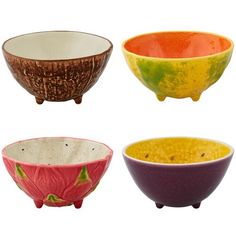 four different colored bowls with designs on them