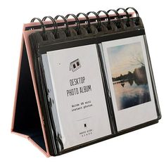 a black and pink desk calendar with pictures on it