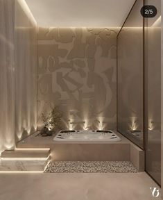 a bathroom with a large jacuzzi tub and lights on the wall above it