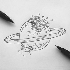 a drawing of saturn with flowers on it and two pens next to it, all in black and white