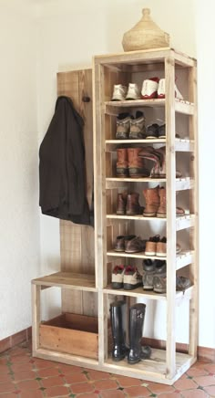 a wooden shoe rack filled with lots of shoes