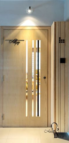 the front door is made of wood and has two sidelights on each side,