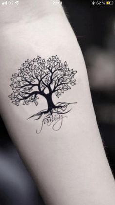 a tree with the word family written on it's left arm, in black ink