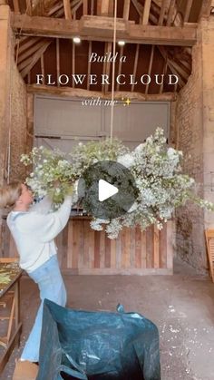 a woman arranging flowers in a flower shop