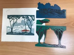 three pieces of paper cut out to look like animals in the woods