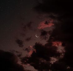 the night sky is filled with clouds, stars and a half moon in the distance