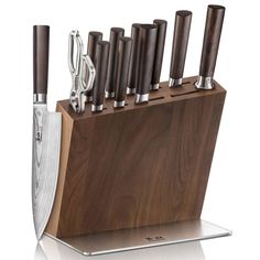 the knife block is holding many knives