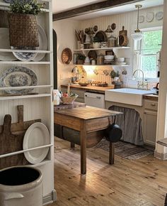 the kitchen is clean and ready to be used for cooking or baking, as well as dishes on shelves