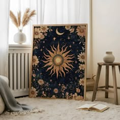 a sun and moon painting on the wall next to a radiator