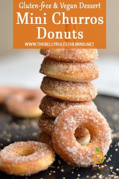 a stack of mini churros sitting on top of a black plate with the words gluten free and vegan dessert