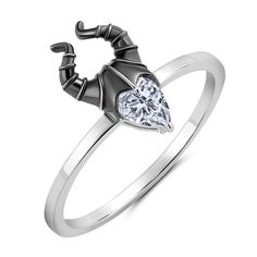 a ring with a heart shaped diamond on it