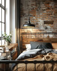 a bedroom with brick wall and wooden headboard in the corner, along with an iron bed frame