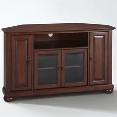 a wooden entertainment center with glass doors on the front and bottom shelves, in dark wood