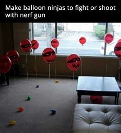 balloons with faces drawn on them in front of a window