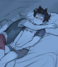 a boy laying in bed with his arm around another guy's neck and head