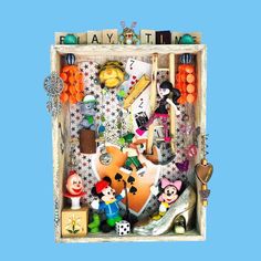 a box filled with lots of assorted items on top of a blue background,