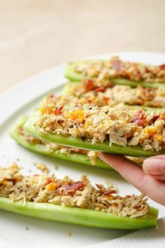 cucumbers stuffed with tuna and vegetables on a plate