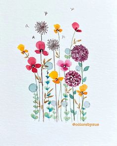 watercolor painting of colorful flowers on white paper