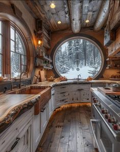 a kitchen with an oval window in the middle and wooden flooring on both sides