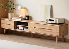 a wooden entertainment center with speakers on it