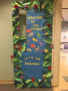 a door decorated with paper cutouts and jungle animals on it's side that says, welcome to the jungle let's go bananas