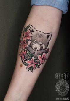 a small tattoo with a fox and flowers on the arm, done by an artist