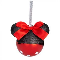 a mickey mouse ornament with a red bow