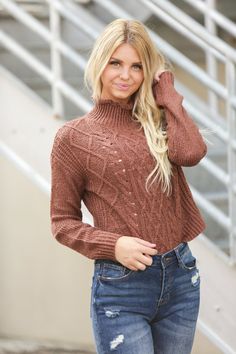 The stretchy textured knit of our Grace Mockneck Sweater makes this stylish sweater also one of the comfiest in your closet. Dress it up with a skirt and booties or jeans and boots because there's no reason to sacrifice your signature style just because it's a little chilly out. Model is 5’7” wearing a size small Length of a small is 19" 54% Cotton, 27% Acrylic, 19% Polyester Fall Knit Mock Neck Turtleneck Top, Winter Knit Mock Neck Top, Winter Knit High Neck Mock Neck Top, Knit Turtleneck Mock Neck Top For Fall, Fall Mock Neck Top For Layering, Winter High Neck Knit Mock Neck Top, Casual Knit Mock Neck Top For Fall, Casual Mock Neck Knit Top For Fall, Pointelle Knit Cropped Sweater For Fall