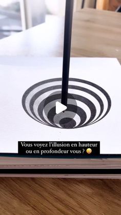 an open book on a table with a pen in it's center and the words, you've voiez illusion en hanteur sur un photovoltition sous?